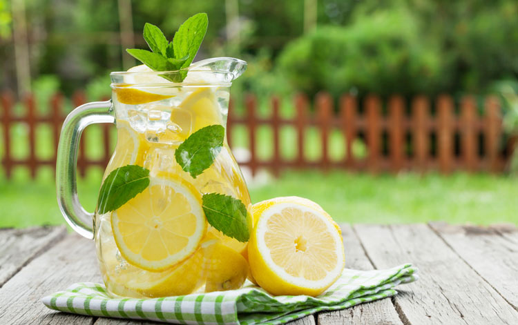 a pitcher of warm lemon water